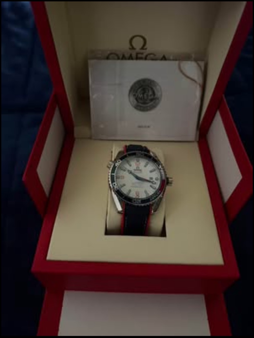 Omega Men's Watch with White Dial and Black/Red Strap